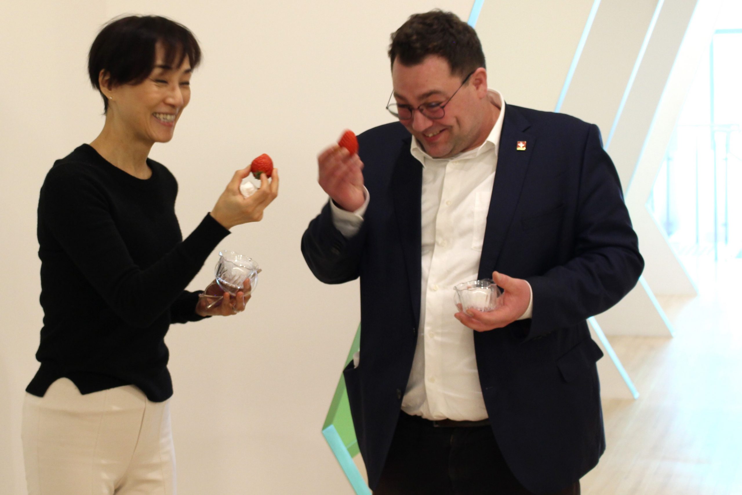Members of the Embassy of Switzerland in Japan tasting vertically farmed strawberry